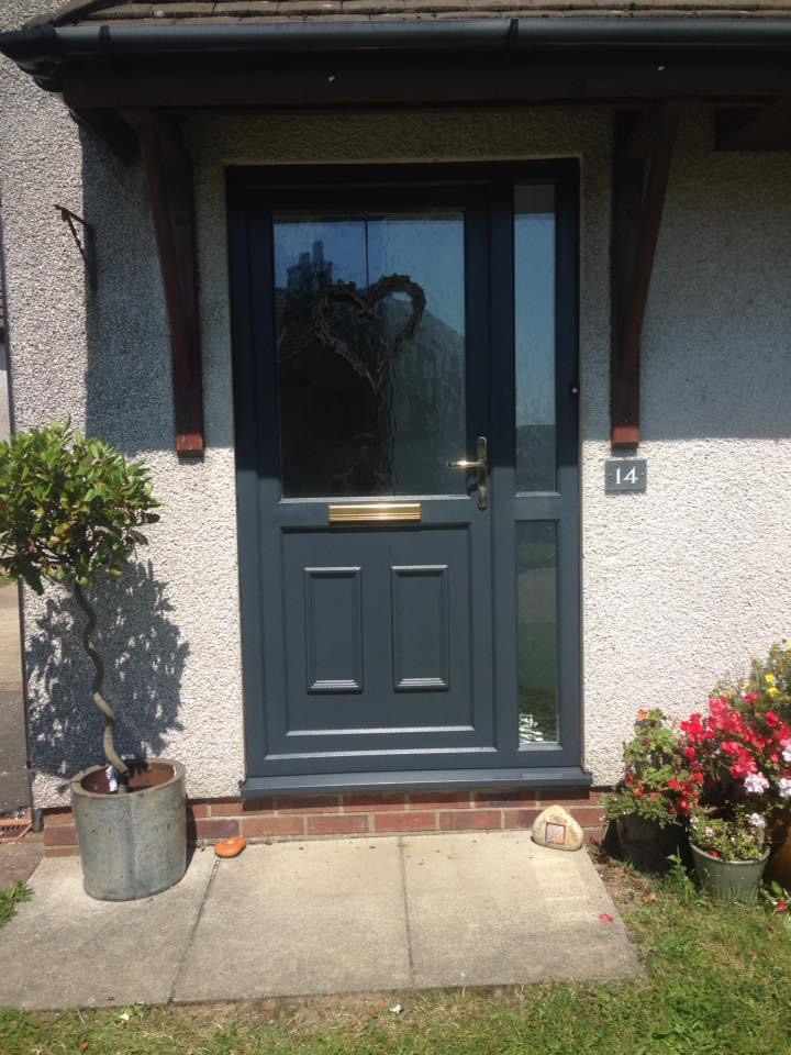 UPVC front door of house spray painted grey