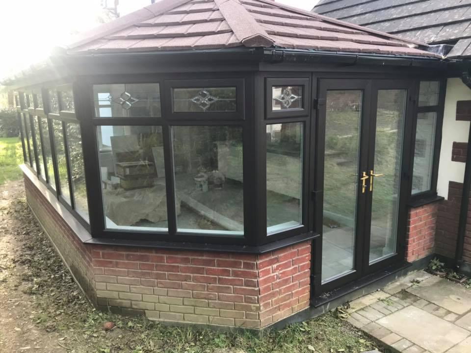 Conservatory windows sprayed in a black UPVC paint colour