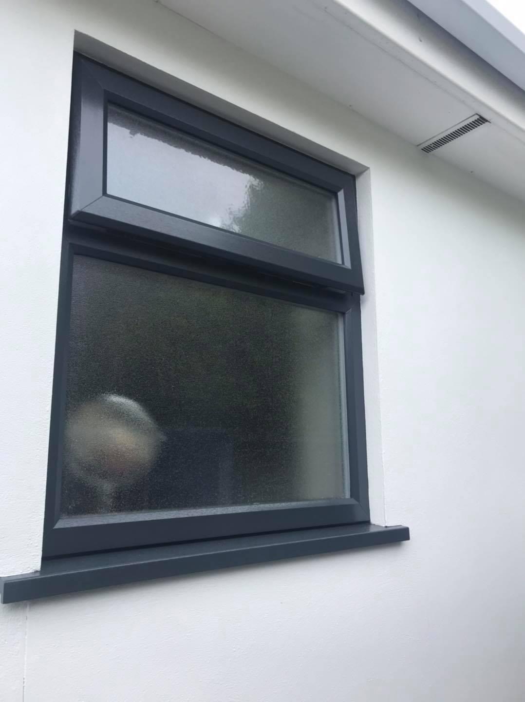 Casement window painted with a grey UPVC colour