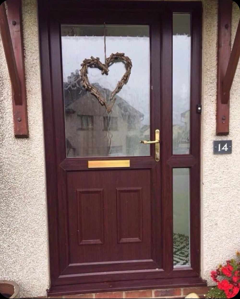 UPVC front door of house spray painted dark red