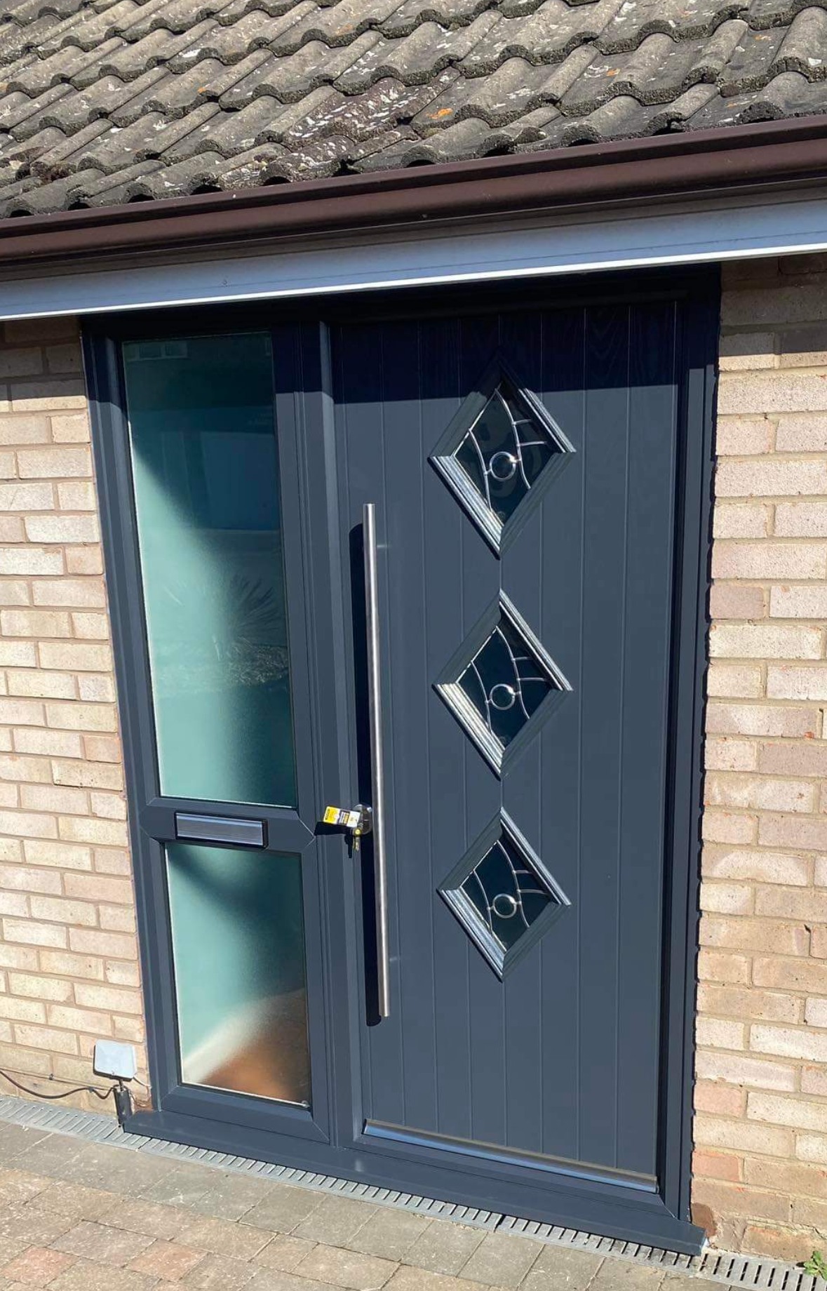 Front door of house with UPVC paint in grey colour